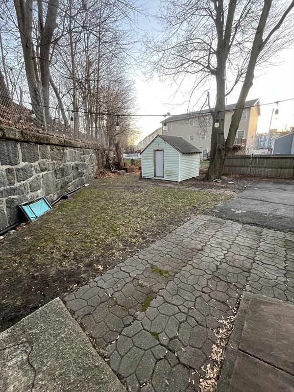 63 Marshfield Street, Unit 1 Boston, MA 02119 - Photo 20 of 26 a view of a house with a yard
