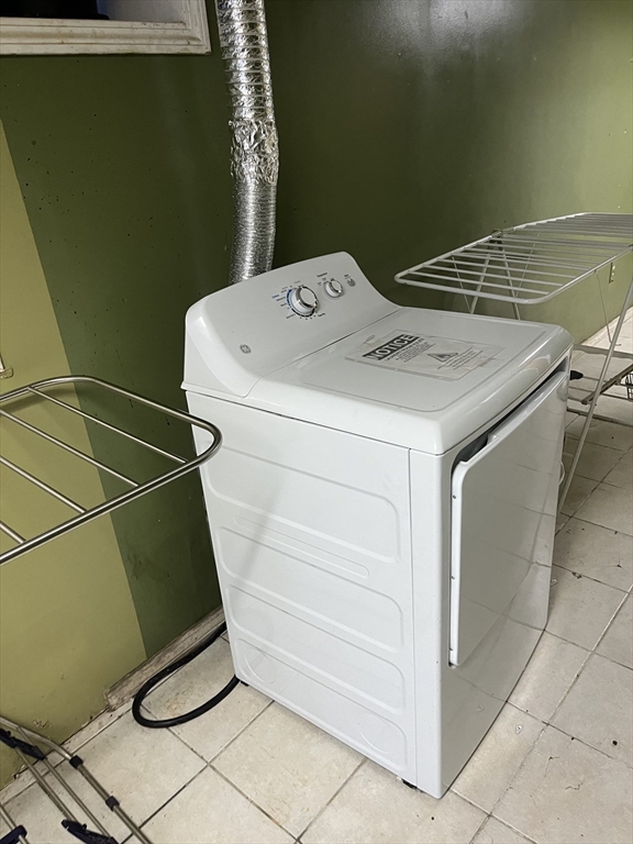 63 Marshfield Street, Unit 1 Boston, MA 02119 - Photo 23 of 26 a utility room with dryer and washer