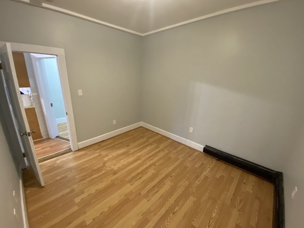 63 Marshfield Street, Unit 1 Boston, MA 02119 - Photo 6 of 26 a view of an empty room