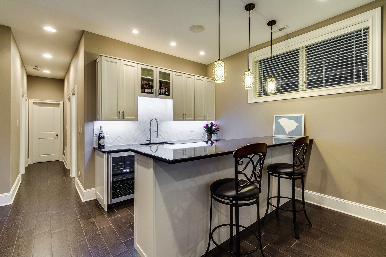 1844 West Huron Street Chicago, IL 60622 - Photo 22 of 34 a dining hall with stainless steel appliances kitchen island granite countertop a dining table chairs and a refrigerator