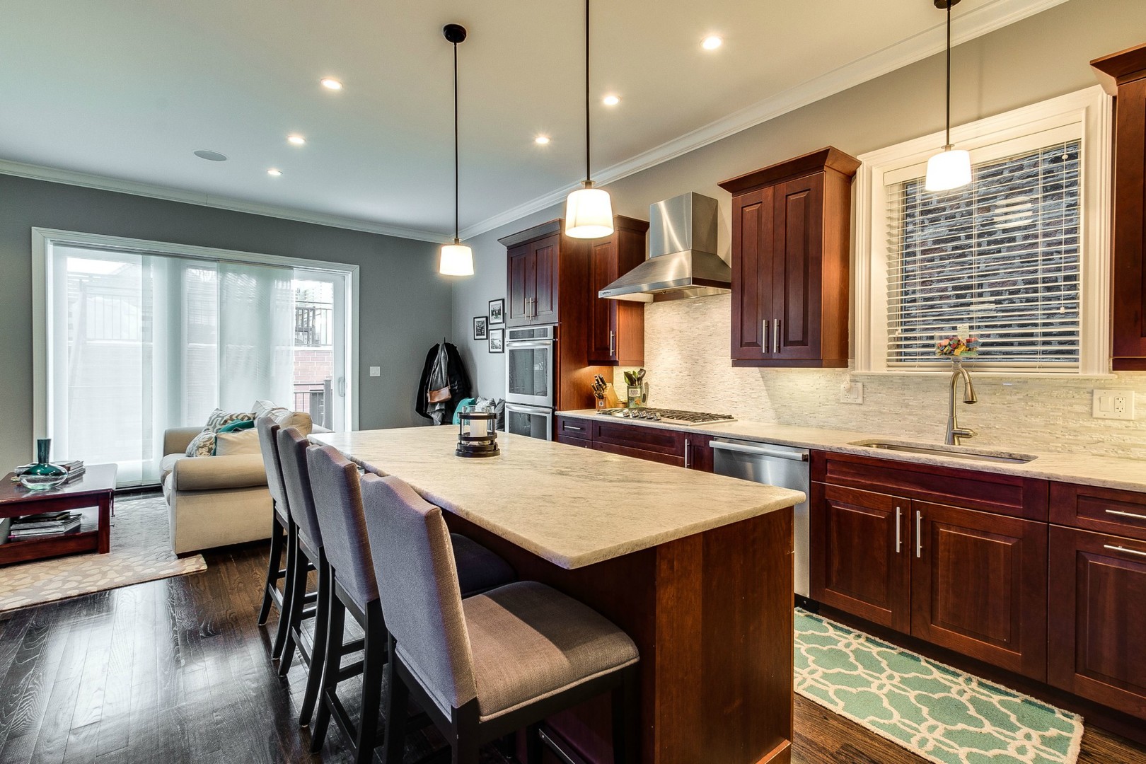 1844 West Huron Street Chicago, IL 60622 - Photo 6 of 34 a kitchen with granite countertop a sink appliances and wooden floor