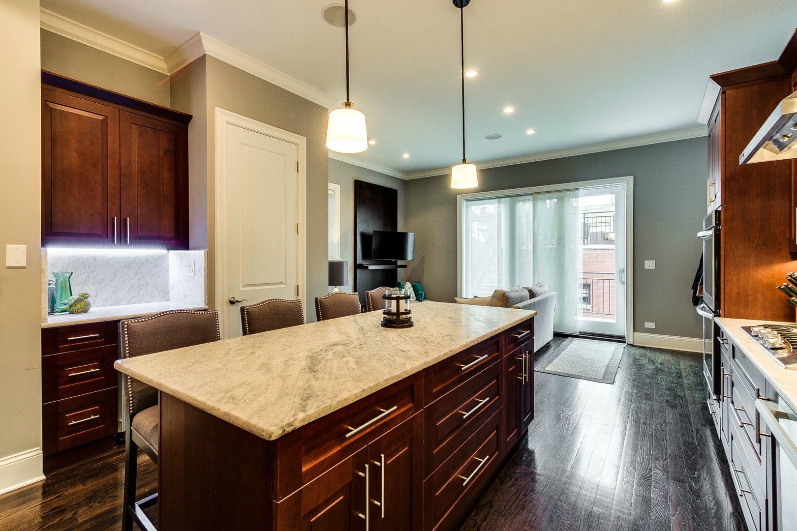 1844 West Huron Street Chicago, IL 60622 - Photo 7 of 34 a kitchen with a stove a sink a dining table and chairs