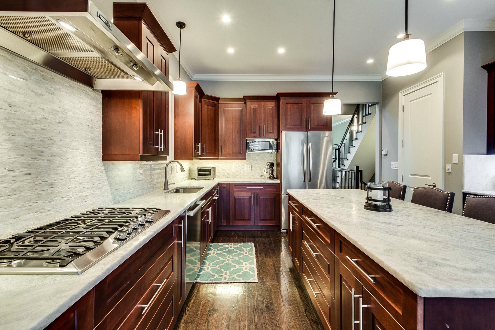 1844 West Huron Street Chicago, IL 60622 - Photo 8 of 34 a kitchen with kitchen island granite countertop a sink stove and cabinets