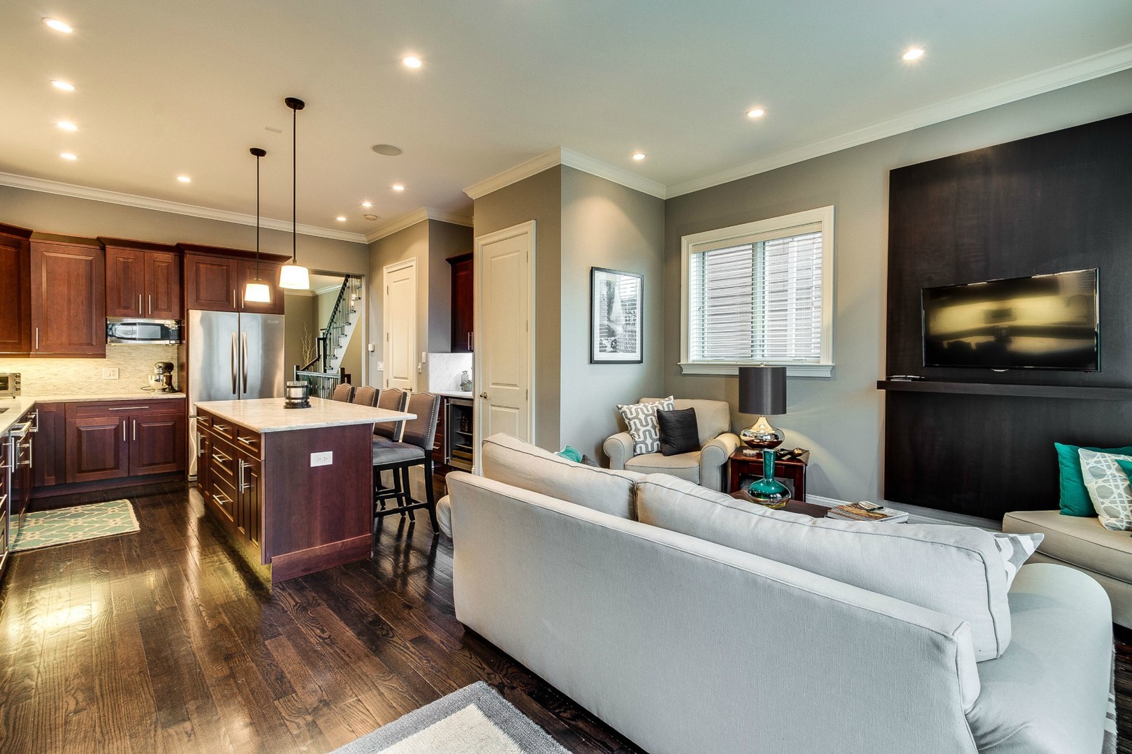 1844 West Huron Street Chicago, IL 60622 - Photo 10 of 34 a living room with furniture a flat screen tv and kitchen view