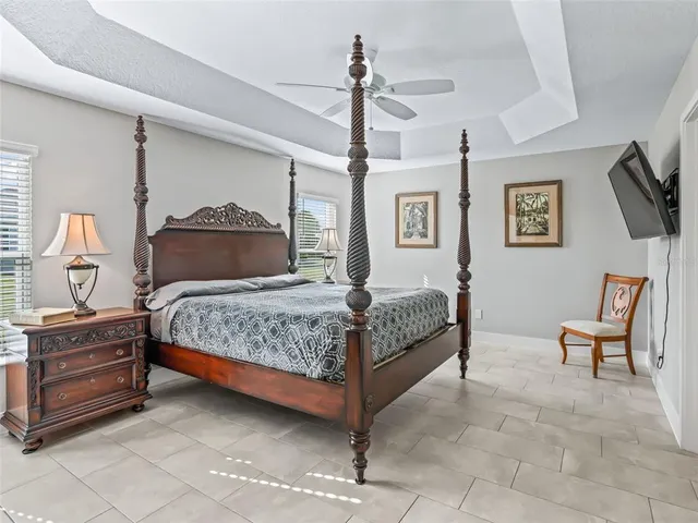 a spacious bathroom with double sink and a mirror