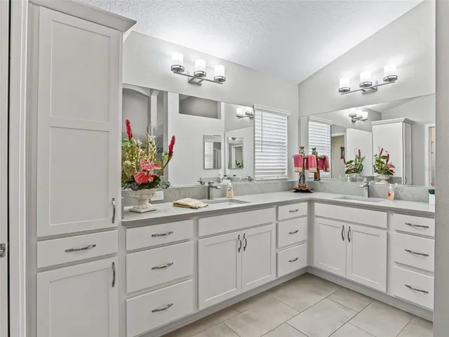 a bedroom with a bed dresser and a window