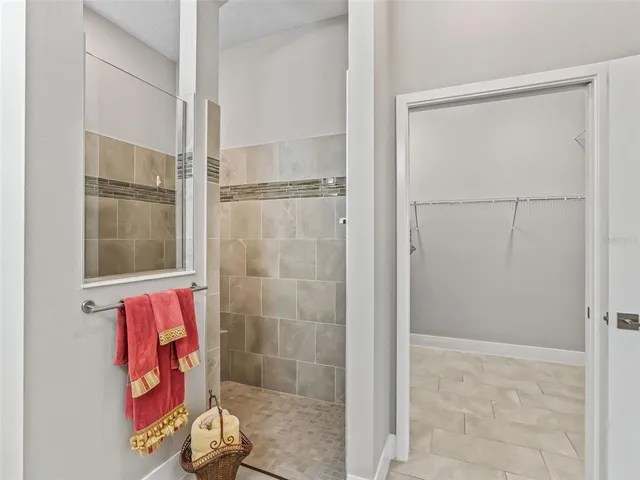 a bathroom with a sink mirror vanity and toilet