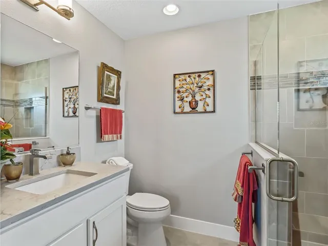 a living room with furniture a chandelier and a large window