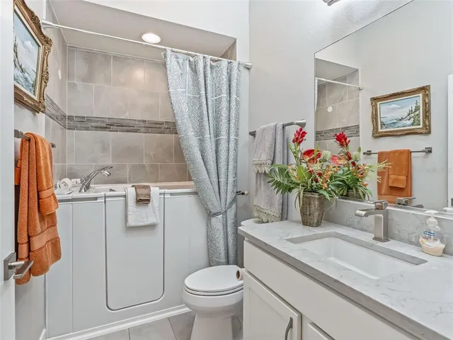 a front view of house with a garden