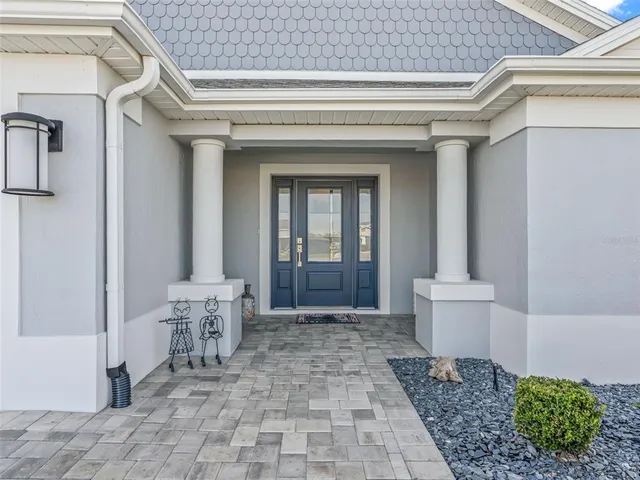 a view of a livingroom with a dinning area closet and a large window
