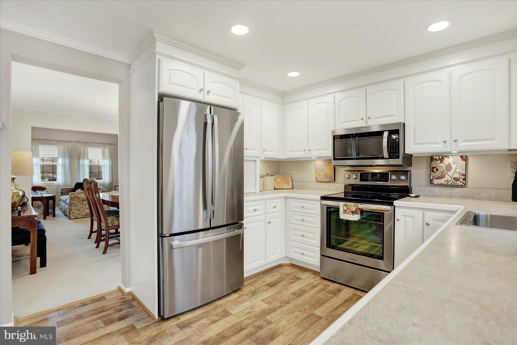 9228 Bowline Road Baltimore, MD 21236 - Photo 12 of 48 a kitchen with a refrigerator stove and microwave