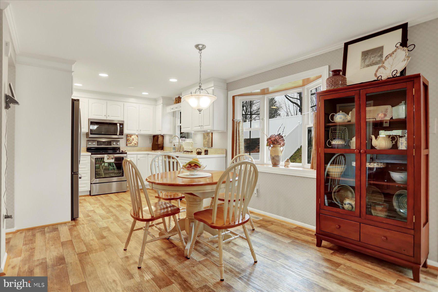 9228 Bowline Road Baltimore, MD 21236 - Photo 15 of 48 a view of a dining room with furniture
