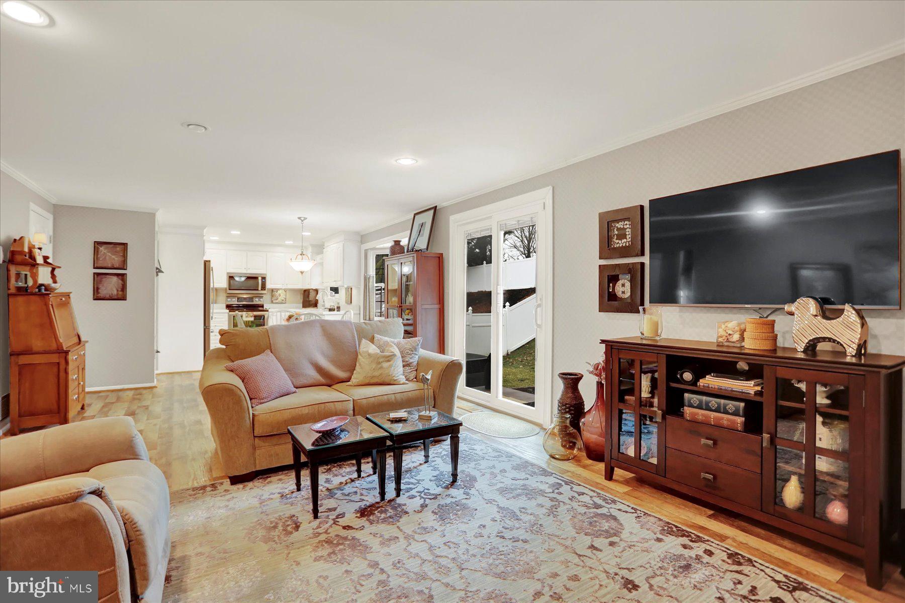 9228 Bowline Road Baltimore, MD 21236 - Photo 20 of 48 a living room with furniture and a flat screen tv