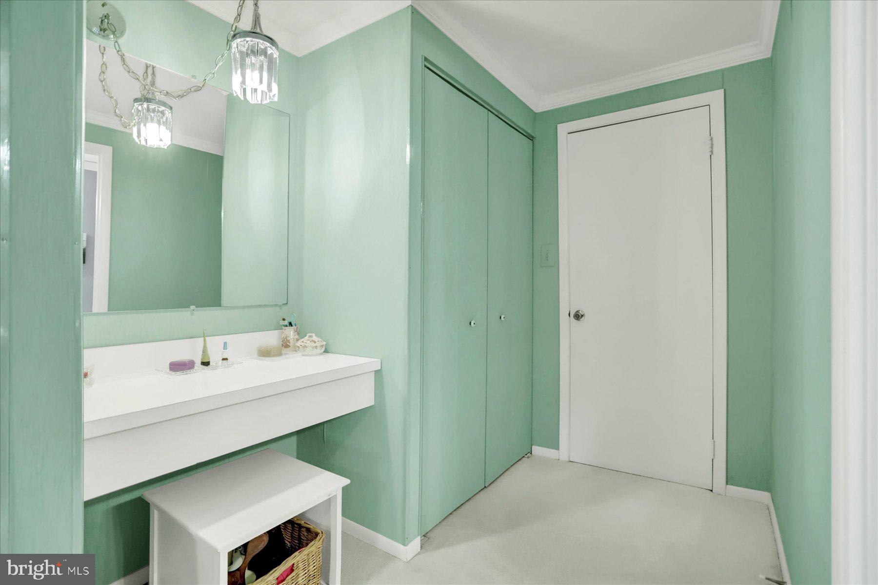 9228 Bowline Road Baltimore, MD 21236 - Photo 25 of 48 a bathroom with a sink a light fixture and a mirror