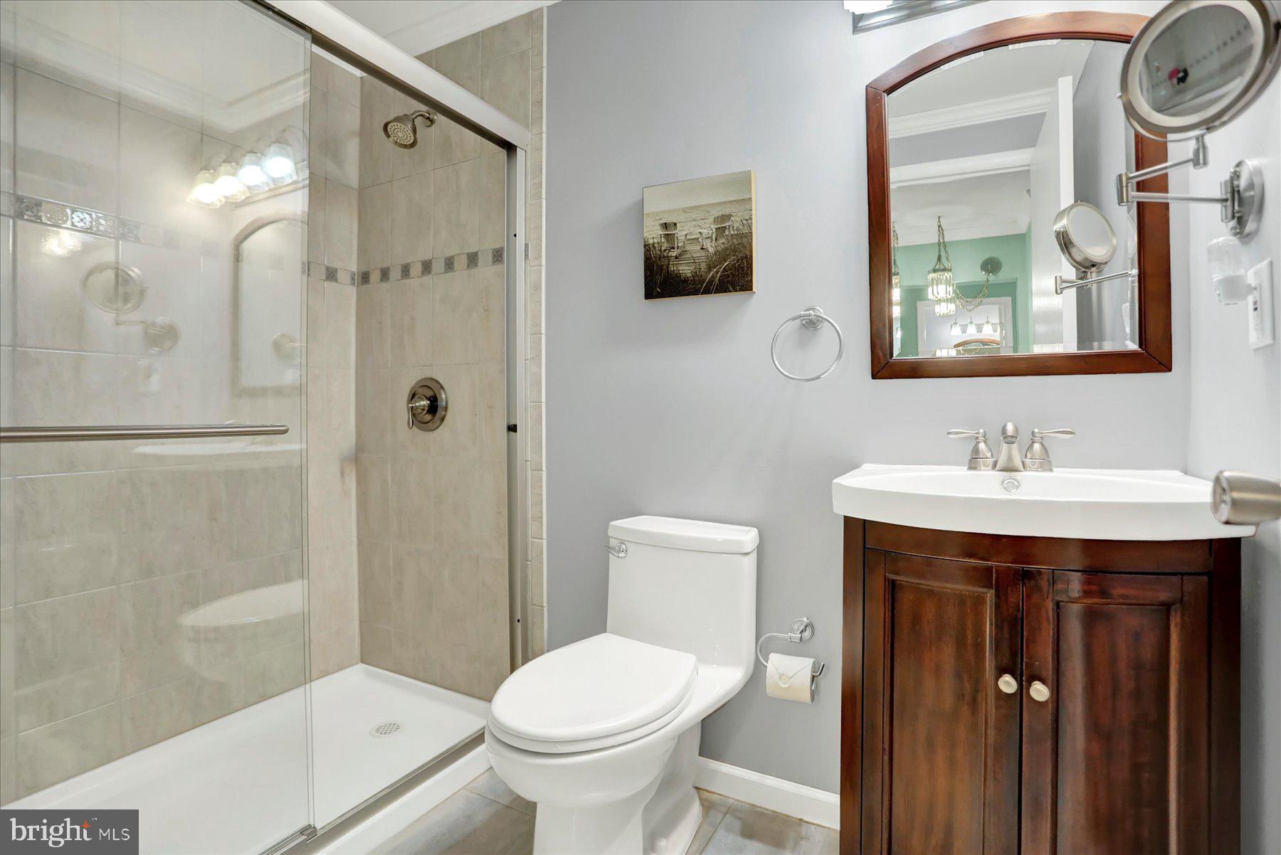 9228 Bowline Road Baltimore, MD 21236 - Photo 26 of 48 a bathroom with a sink toilet and shower