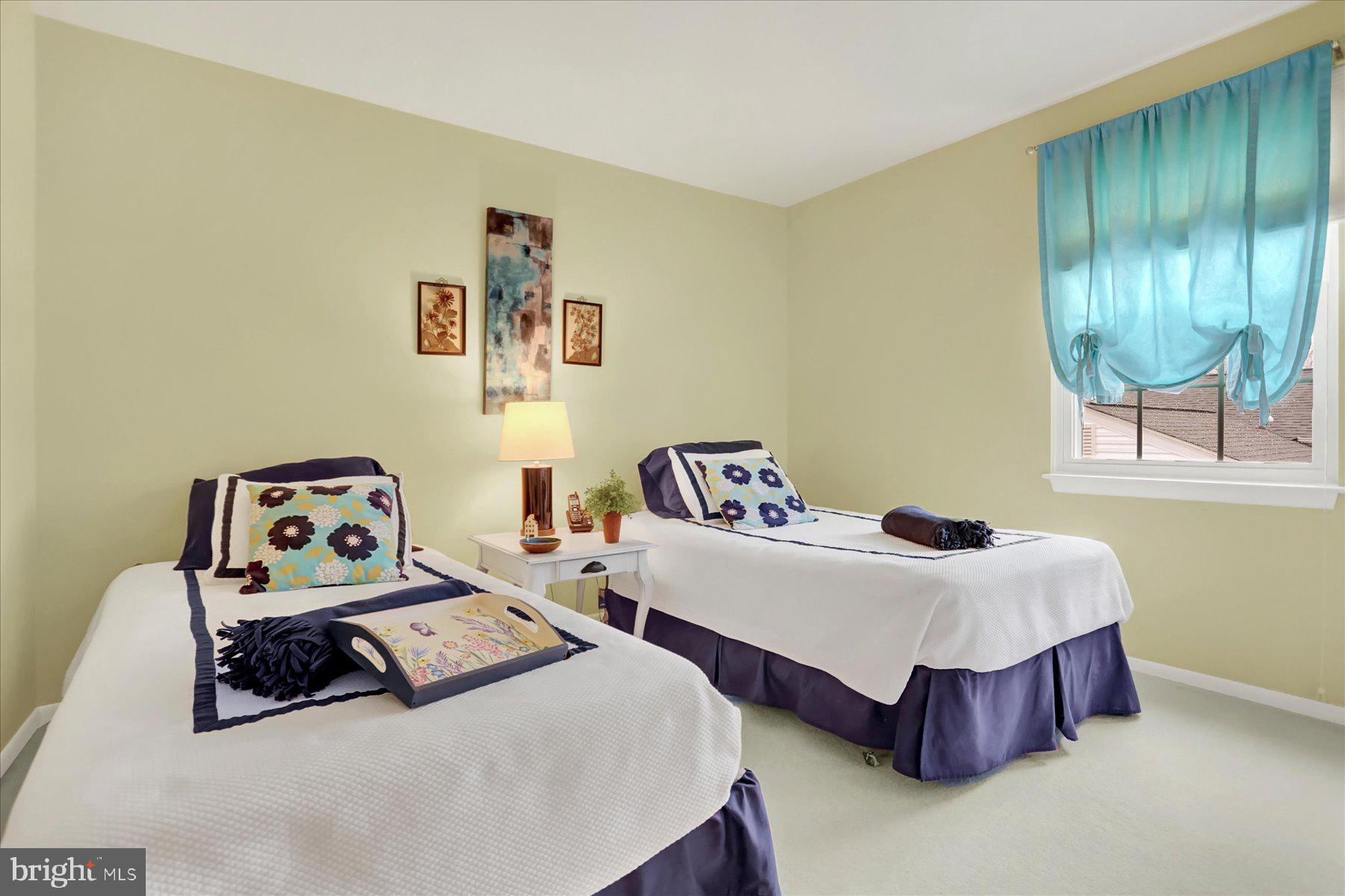 9228 Bowline Road Baltimore, MD 21236 - Photo 27 of 48 a bedroom with two beds and a painting on the wall