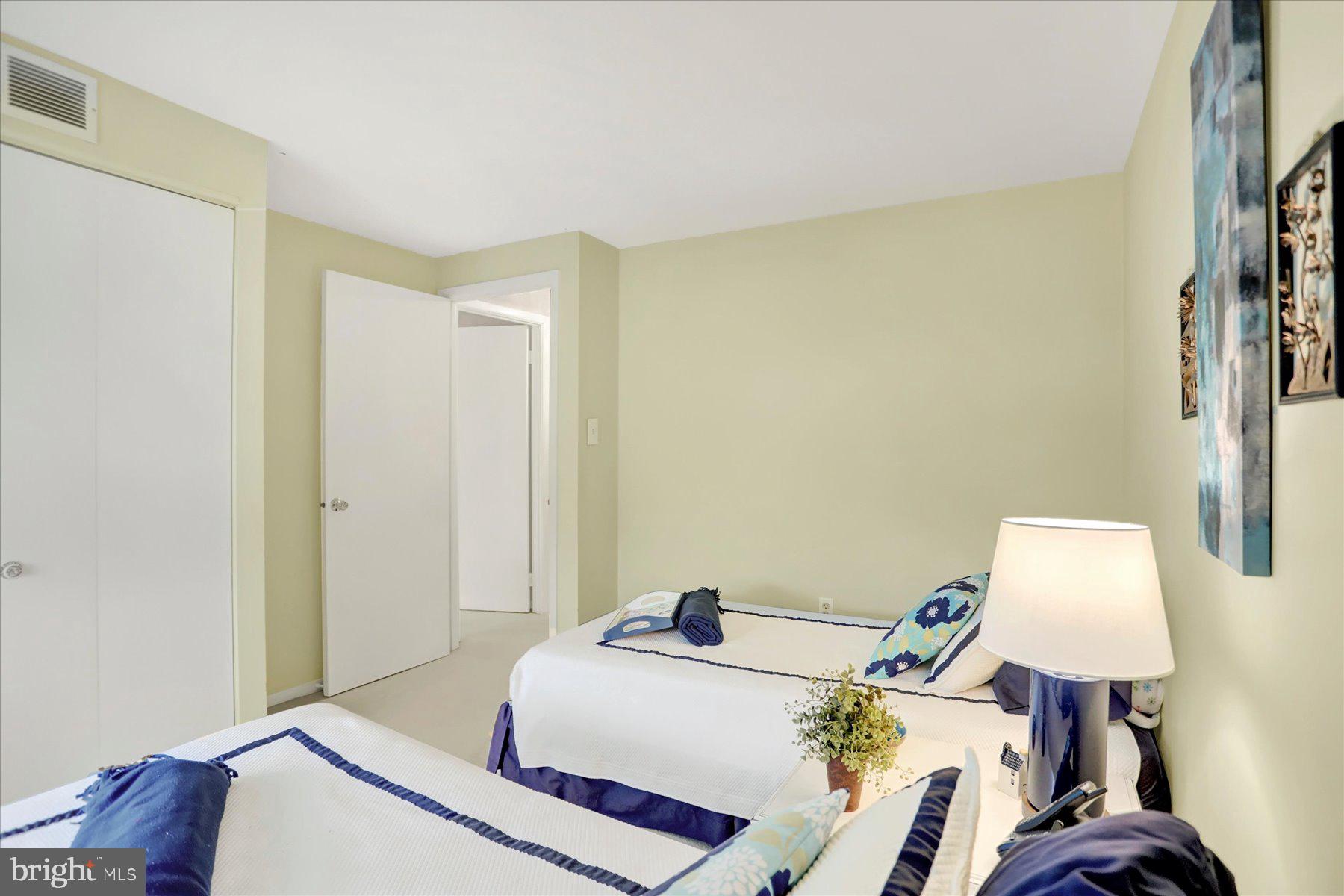 9228 Bowline Road Baltimore, MD 21236 - Photo 28 of 48 a bedroom with a bed and a lamp on the dresser