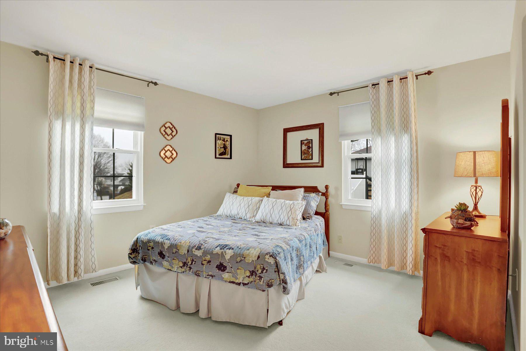 9228 Bowline Road Baltimore, MD 21236 - Photo 29 of 48 a bedroom with a bed and a walk in closet