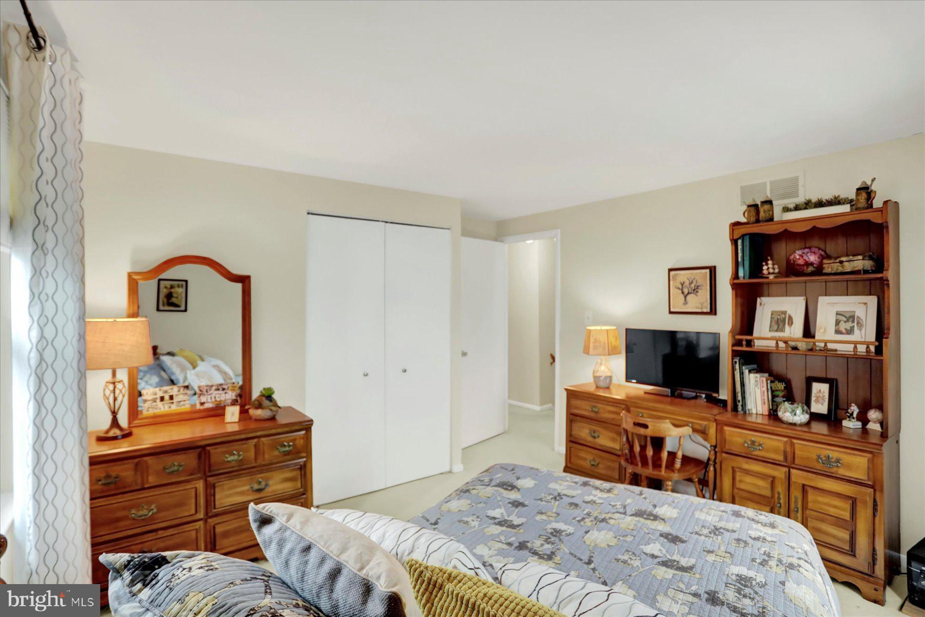 9228 Bowline Road Baltimore, MD 21236 - Photo 30 of 48 a bedroom with a bed and a television in it