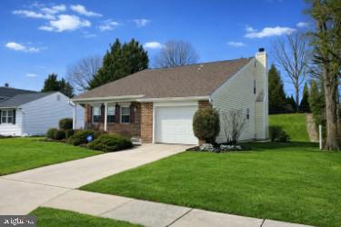9228 Bowline Road Baltimore, MD 21236 - Photo 3 of 48 a view of a white house with a yard