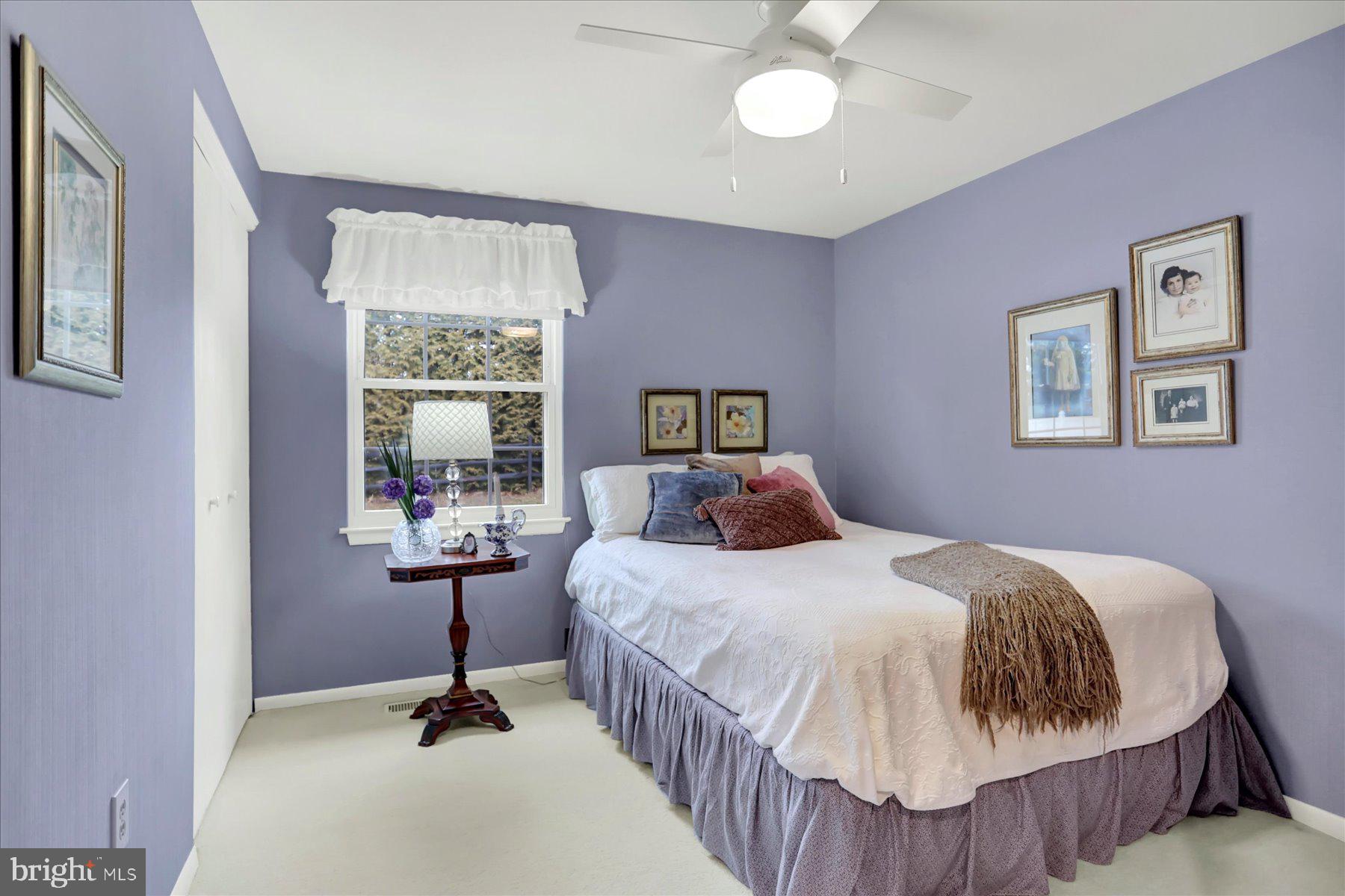 9228 Bowline Road Baltimore, MD 21236 - Photo 31 of 48 a bedroom with a bed and a table