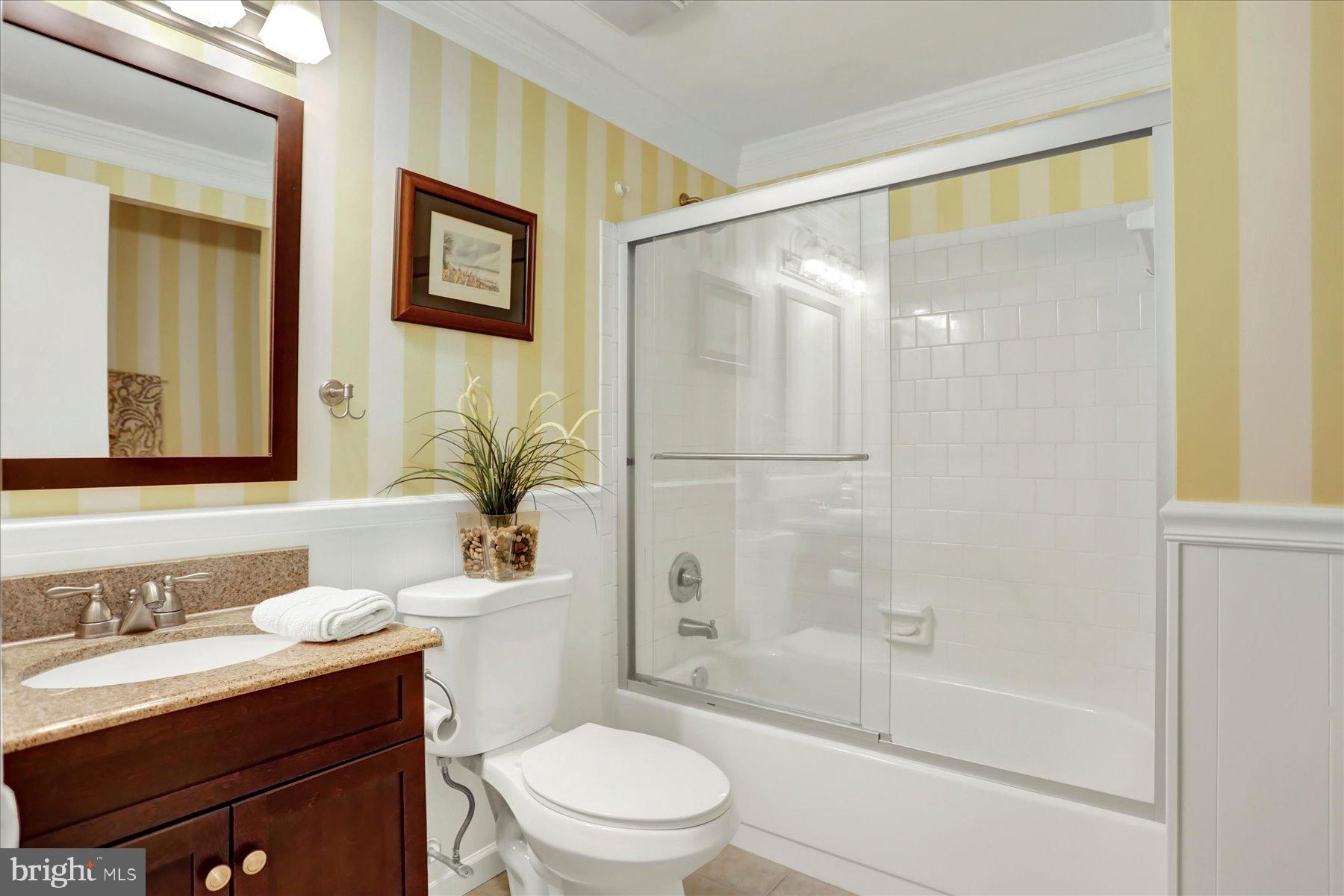 9228 Bowline Road Baltimore, MD 21236 - Photo 33 of 48 a bathroom with a bathtub shower sink vanity mirror and toilet