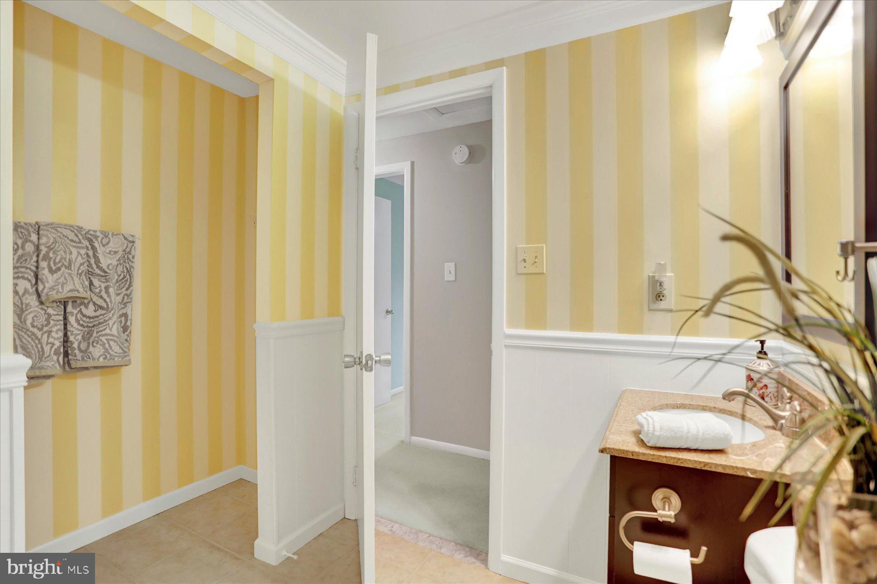 9228 Bowline Road Baltimore, MD 21236 - Photo 34 of 48 a bathroom with a sink and a mirror