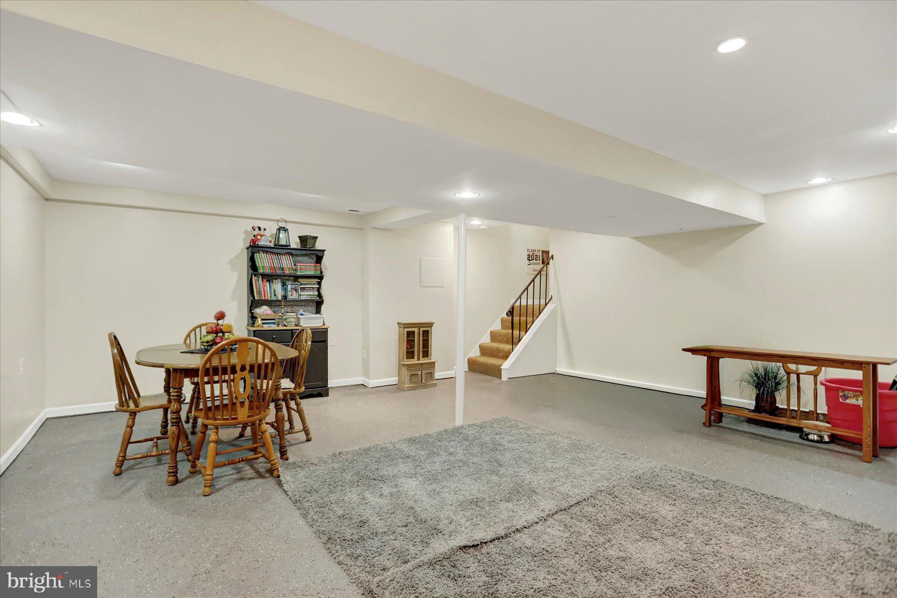 9228 Bowline Road Baltimore, MD 21236 - Photo 35 of 48 a dining room with furniture and a wooden floor