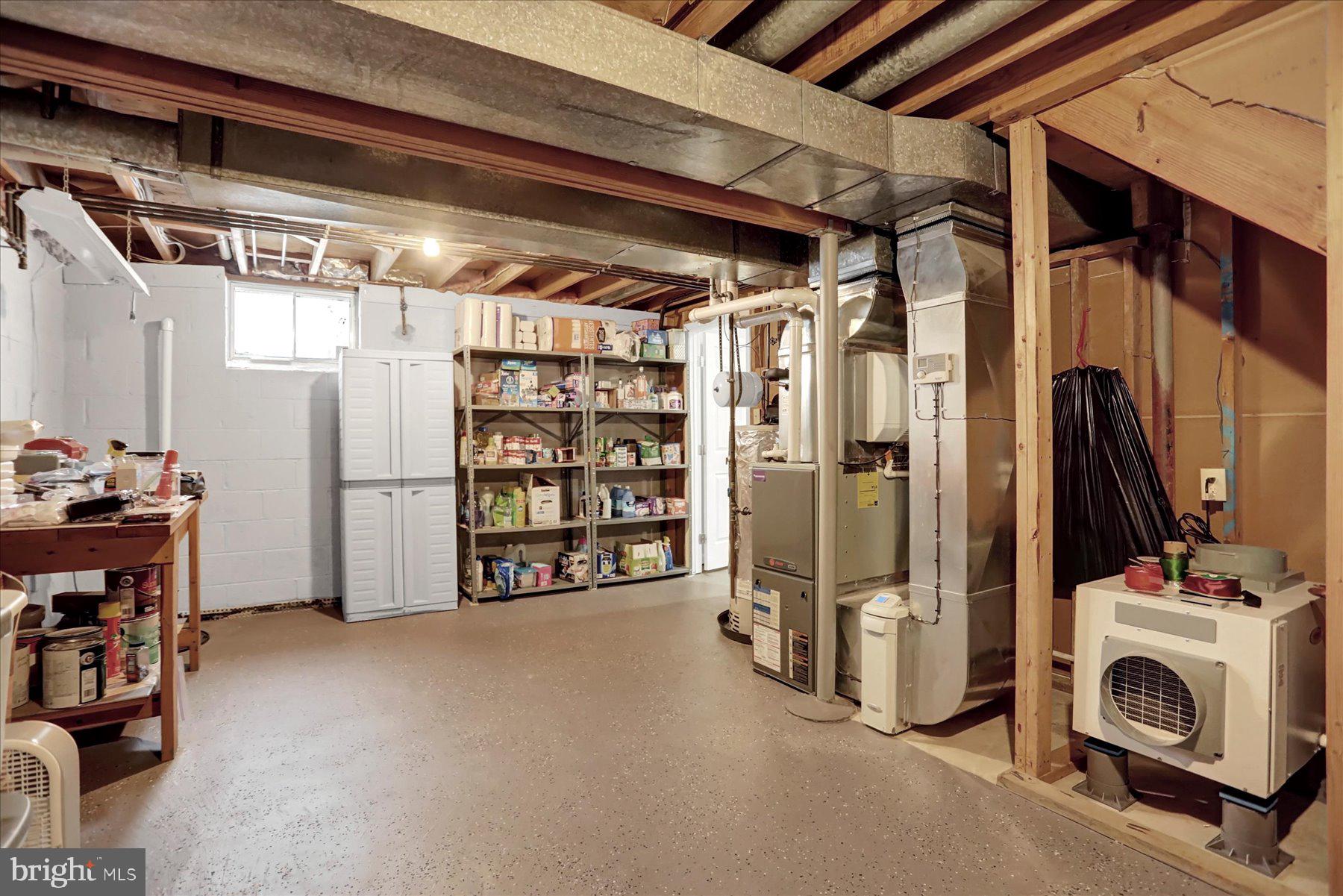 9228 Bowline Road Baltimore, MD 21236 - Photo 38 of 48 a view of walk in closet with clothes and shoes