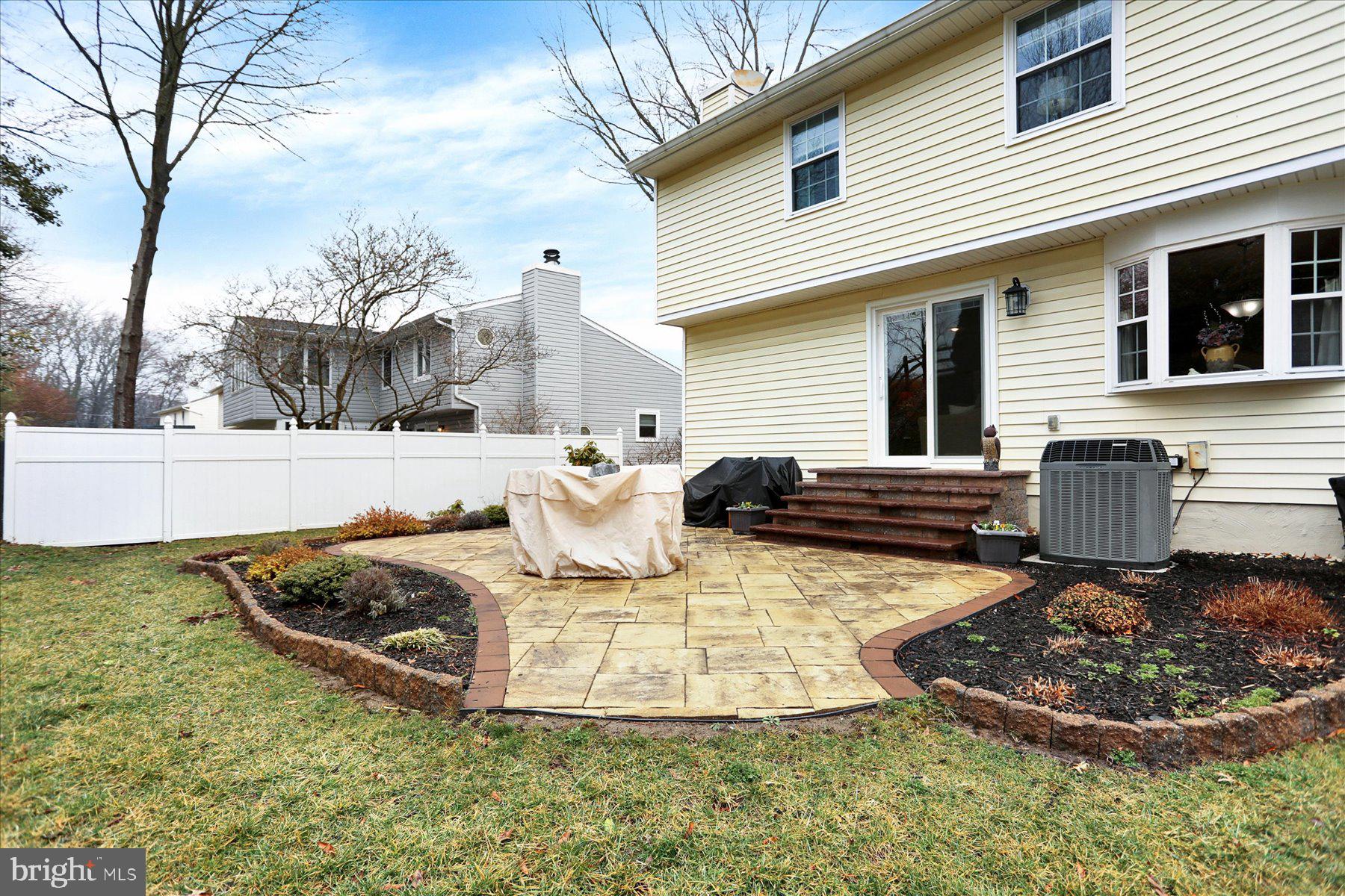 9228 Bowline Road Baltimore, MD 21236 - Photo 44 of 48 a view of a backyard with plants and a tree