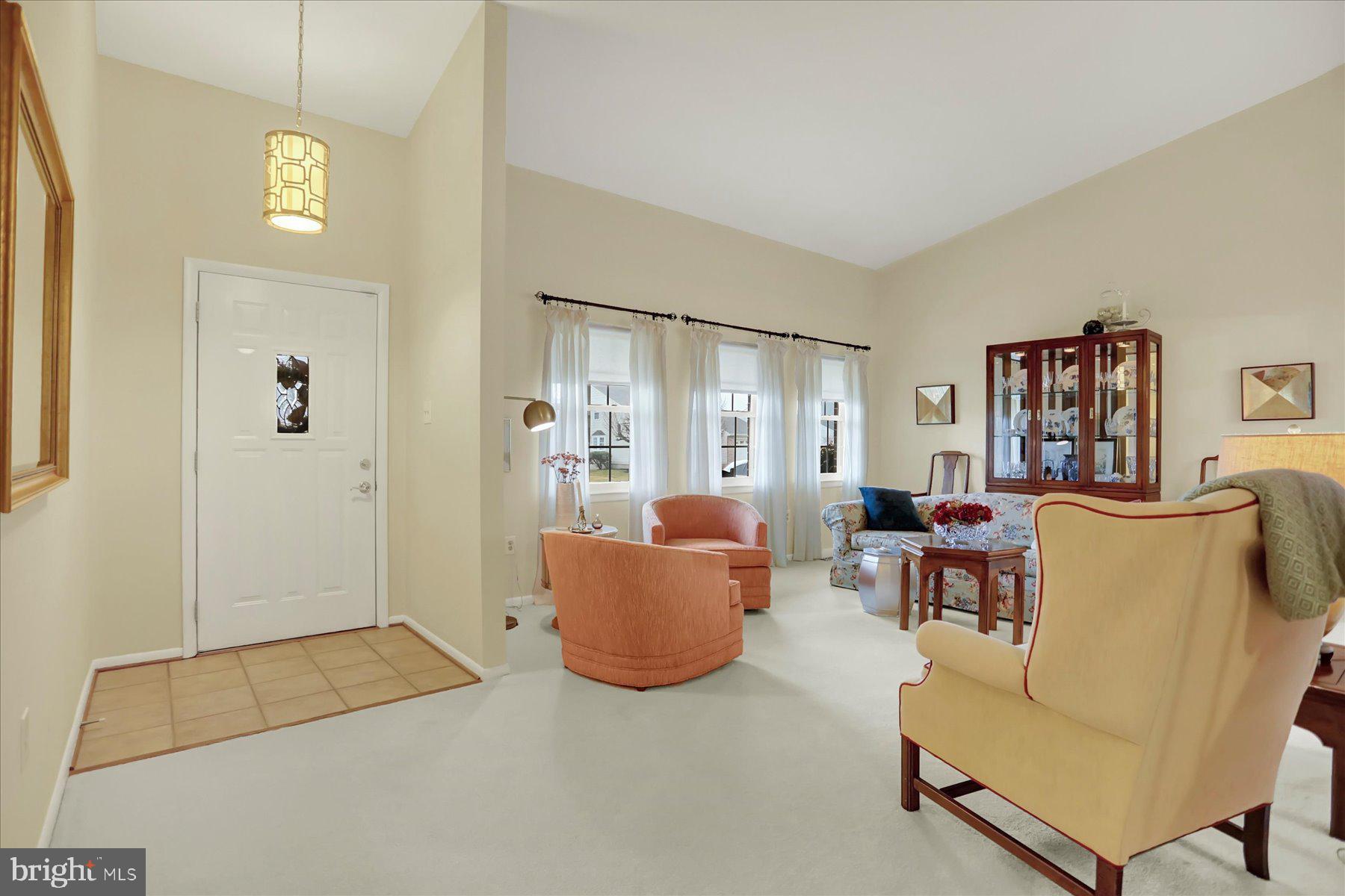 9228 Bowline Road Baltimore, MD 21236 - Photo 5 of 48 a living room with furniture and a table