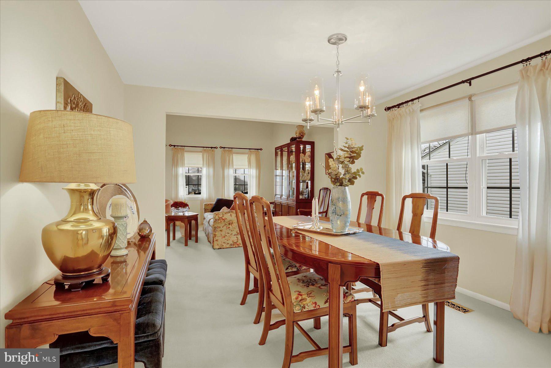 9228 Bowline Road Baltimore, MD 21236 - Photo 10 of 48 a view of a dining room with furniture and chandelier