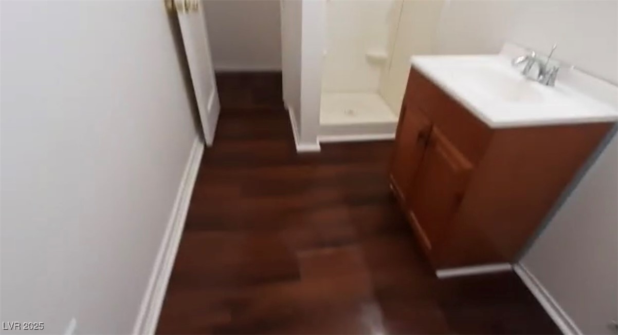 180 North Jones Street, Unit 5 Overton, NV 89040 - Photo 13 of 14 Full bathroom featuring a shower stall, vanity, an