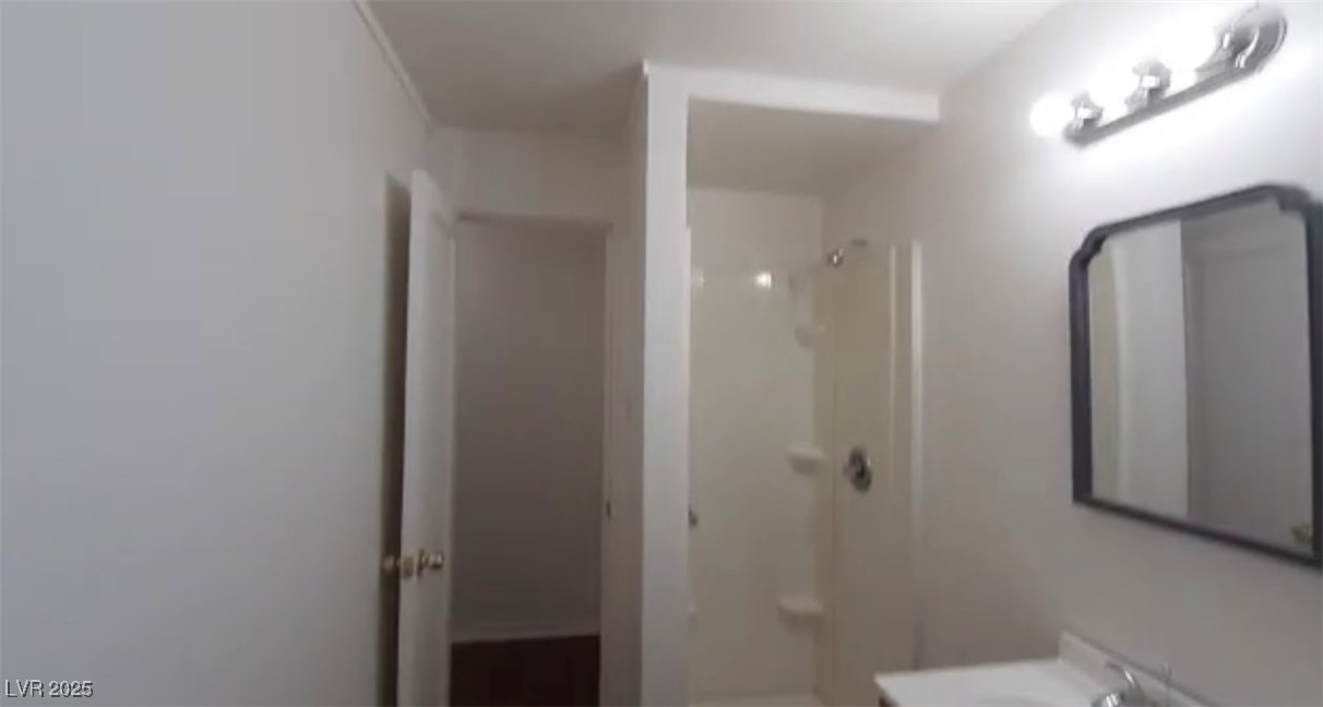 180 North Jones Street, Unit 5 Overton, NV 89040 - Photo 14 of 14 Full bathroom featuring a shower and vanity