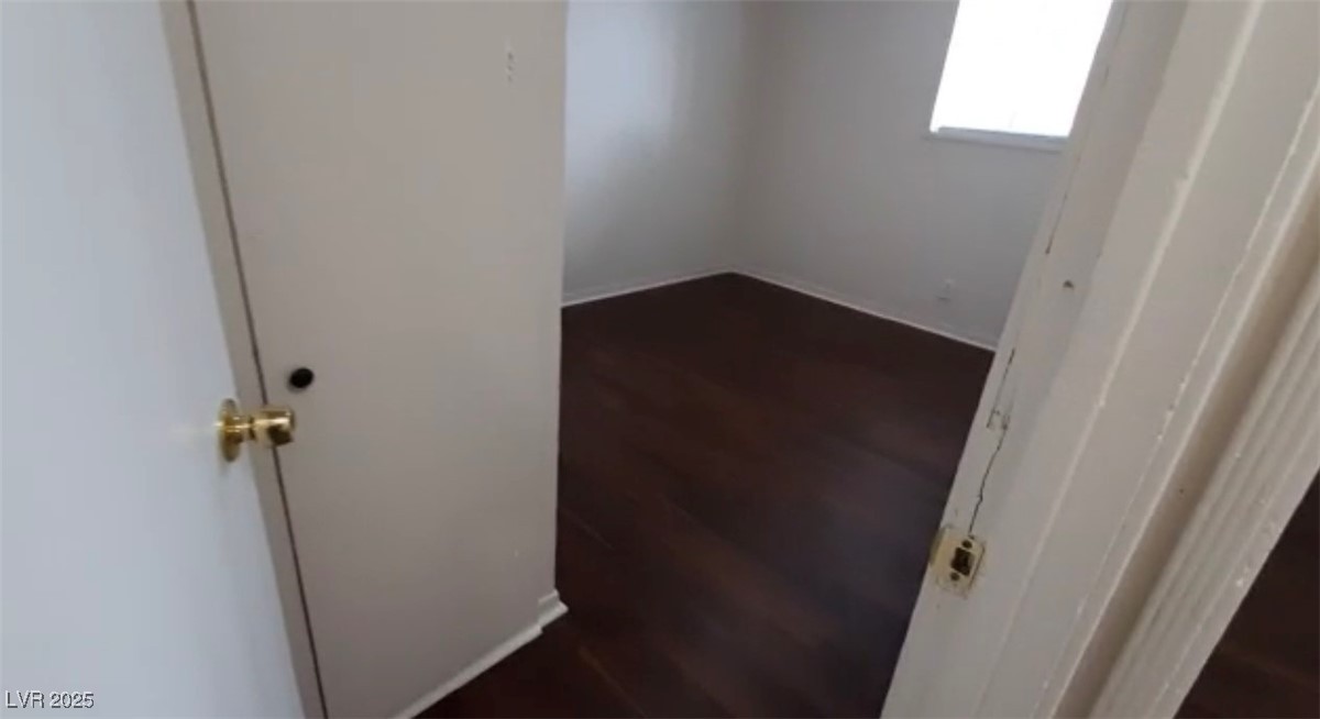 180 North Jones Street, Unit 5 Overton, NV 89040 - Photo 9 of 14 Spare room with dark wood-style flooring and baseb