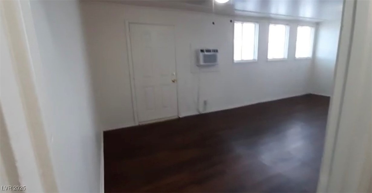 180 North Jones Street, Unit 5 Overton, NV 89040 - Photo 10 of 14 Entryway with a wall unit AC and dark wood-type fl