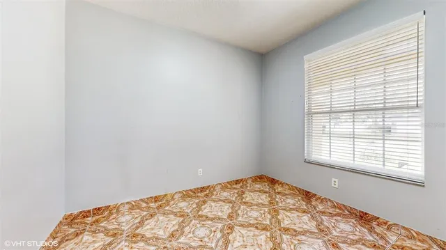 a view of a bedroom with a window