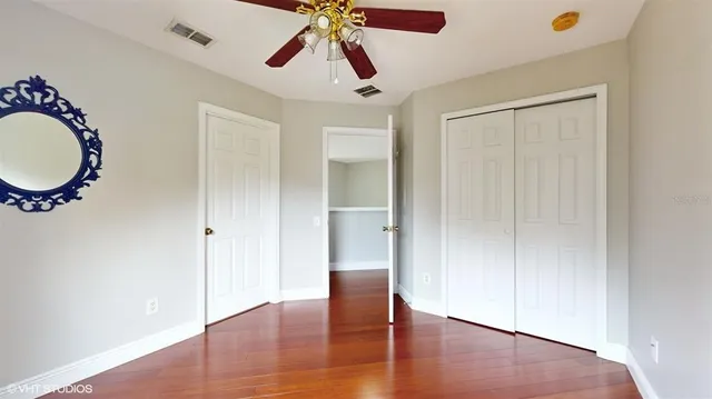 a view of an entryway with wooden floor