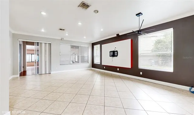 a view of an empty room with a window