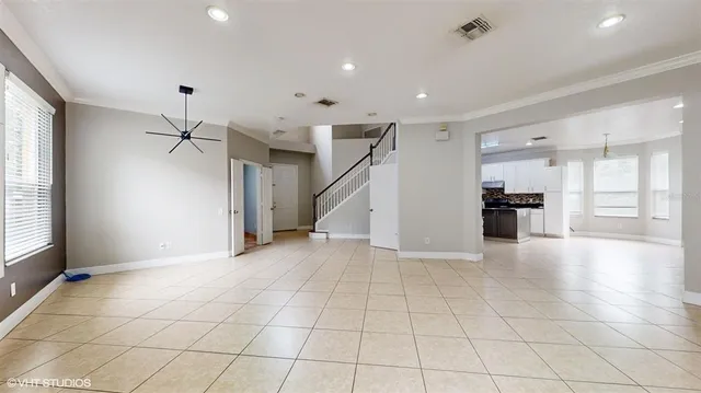 a view of an empty room and a window