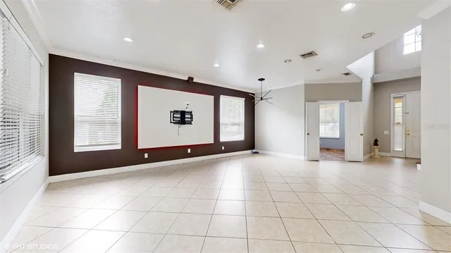 a view of an empty room with a window