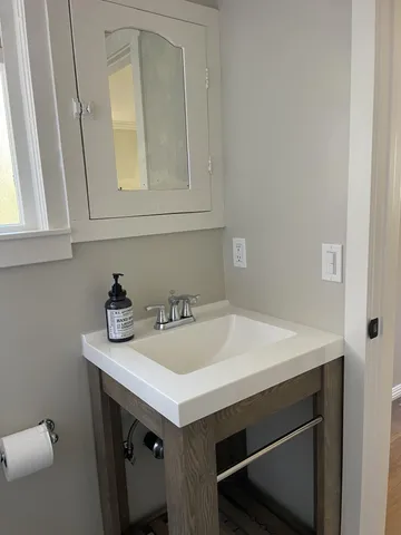 a bathroom with a sink and a vanity