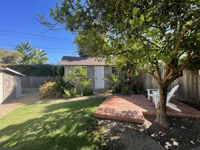 a view of a backyard with a garden