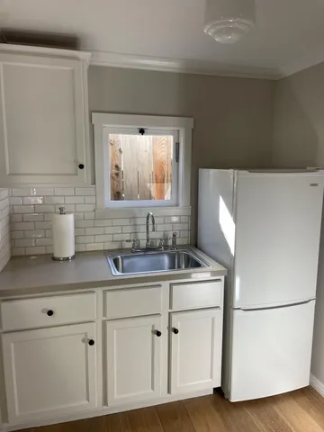 a bathroom with a sink toilet and mirror