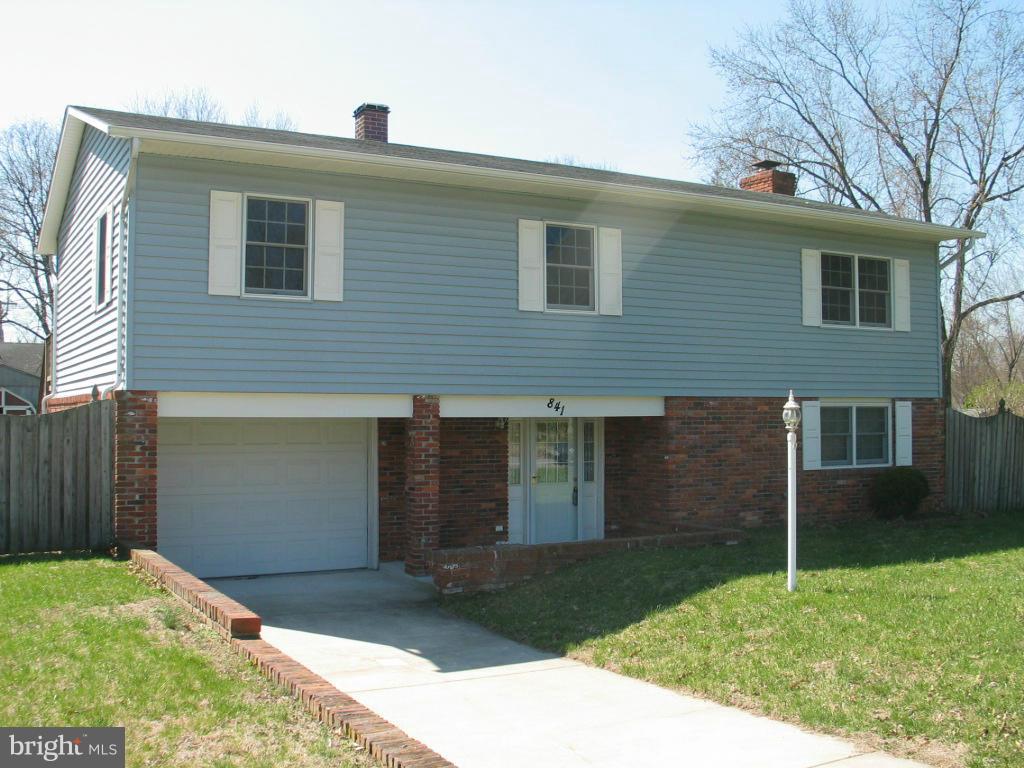841 Evergreen Road Severn, MD 21144 - Photo 1 of 26 a front view of a house with garden