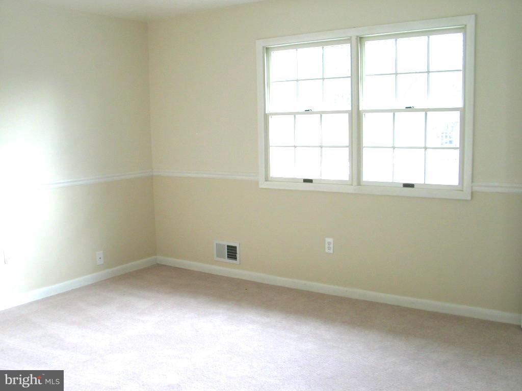 841 Evergreen Road Severn, MD 21144 - Photo 12 of 26 an empty room with a window