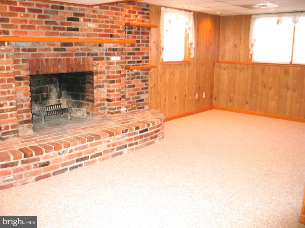 841 Evergreen Road Severn, MD 21144 - Photo 14 of 26 a view of empty room with window and fireplace