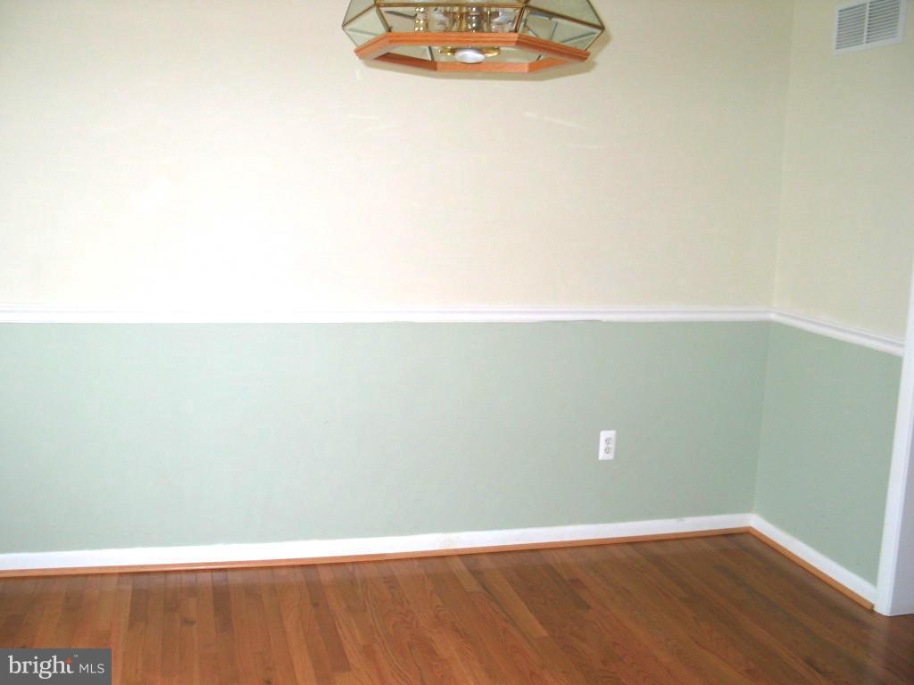 841 Evergreen Road Severn, MD 21144 - Photo 10 of 26 a view of a room with wooden floor