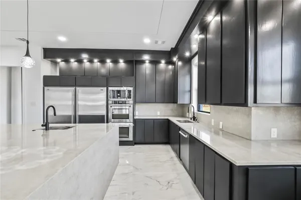 a large bathroom with a large tub and sink