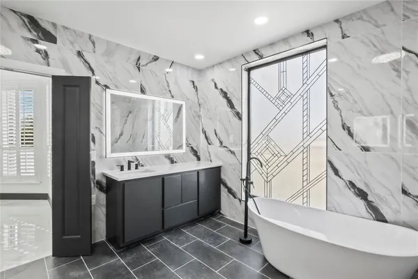 a view of entryway and hall with a chair